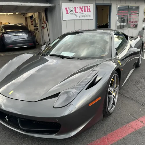 Younik Auto Detailing completed this Ceramic Coating of a silver ferrari shown here outside their shop after the service